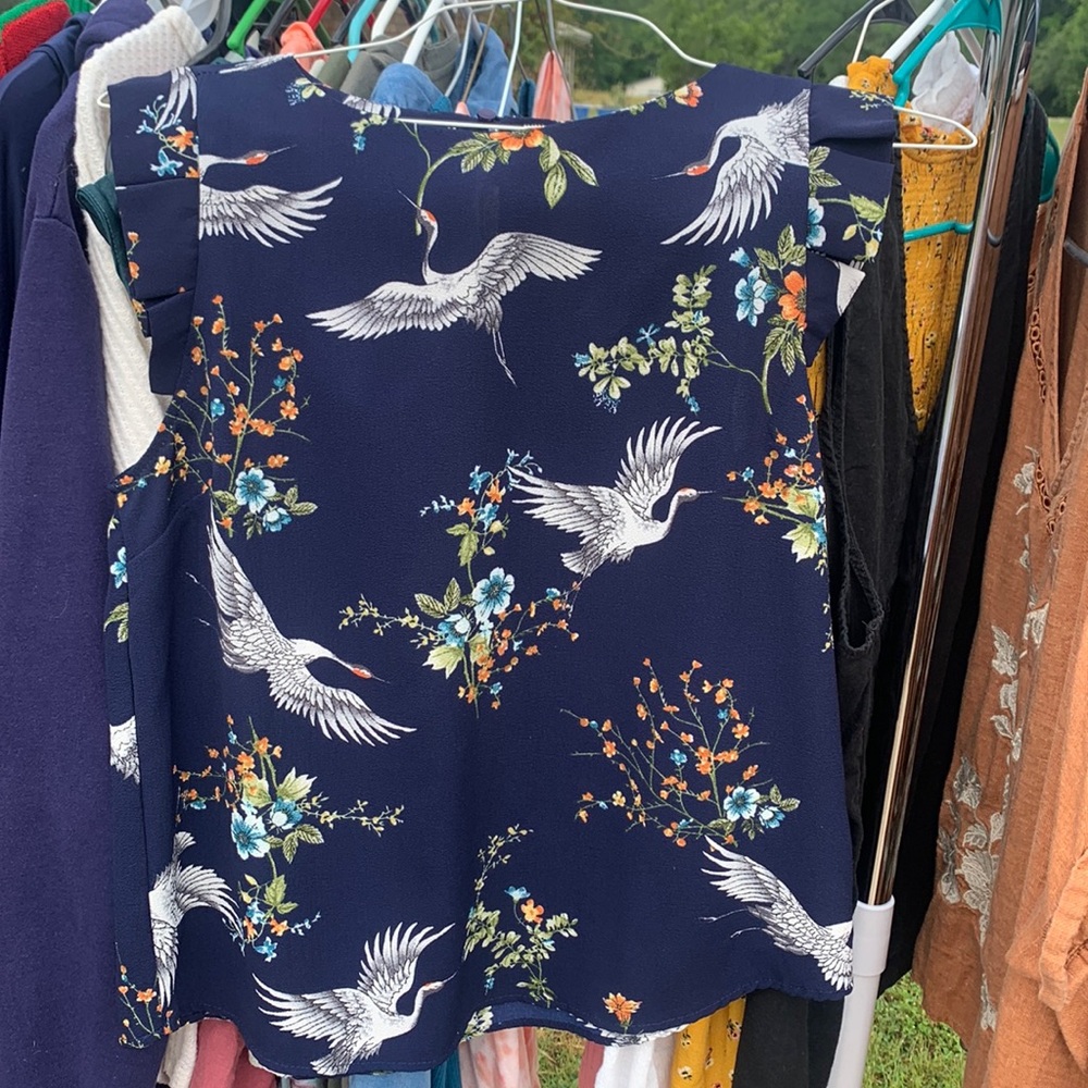 Flutter-sleeved navy top with cranes.